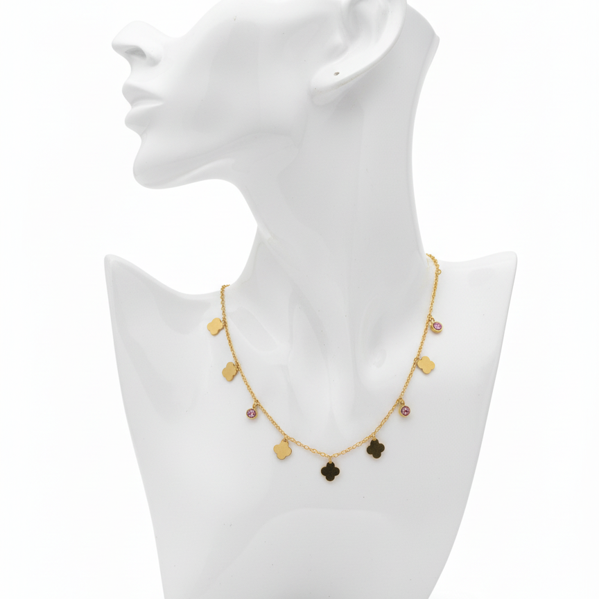 Gold necklace with dark beads on a white mannequin bust