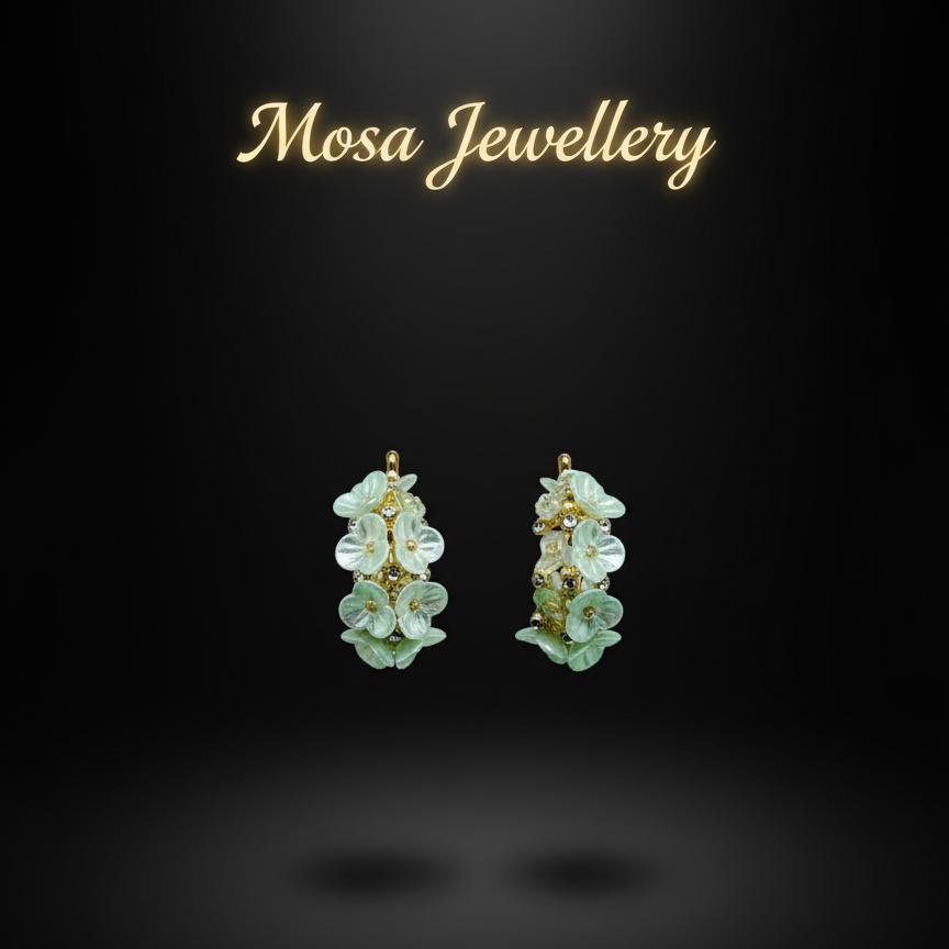 Pair of green floral earrings on a black background with 'Mosa Jewellery' text.