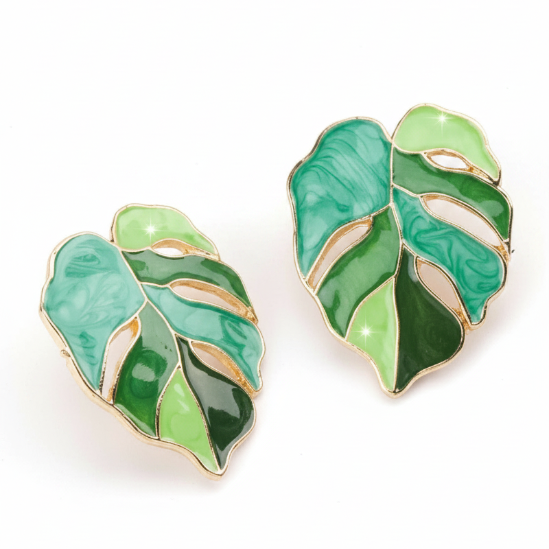 Green leaf-shaped earrings on a white background